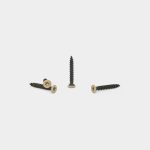 WoodUpp product photograph showing four WoodUpp wood screws arranged on a white background: one screw upright and three laid flat. Each is a black, coarse-threaded screw with a flat, countersunk, tan-coated star-drive head, designed for timber fastening and concealed finish.