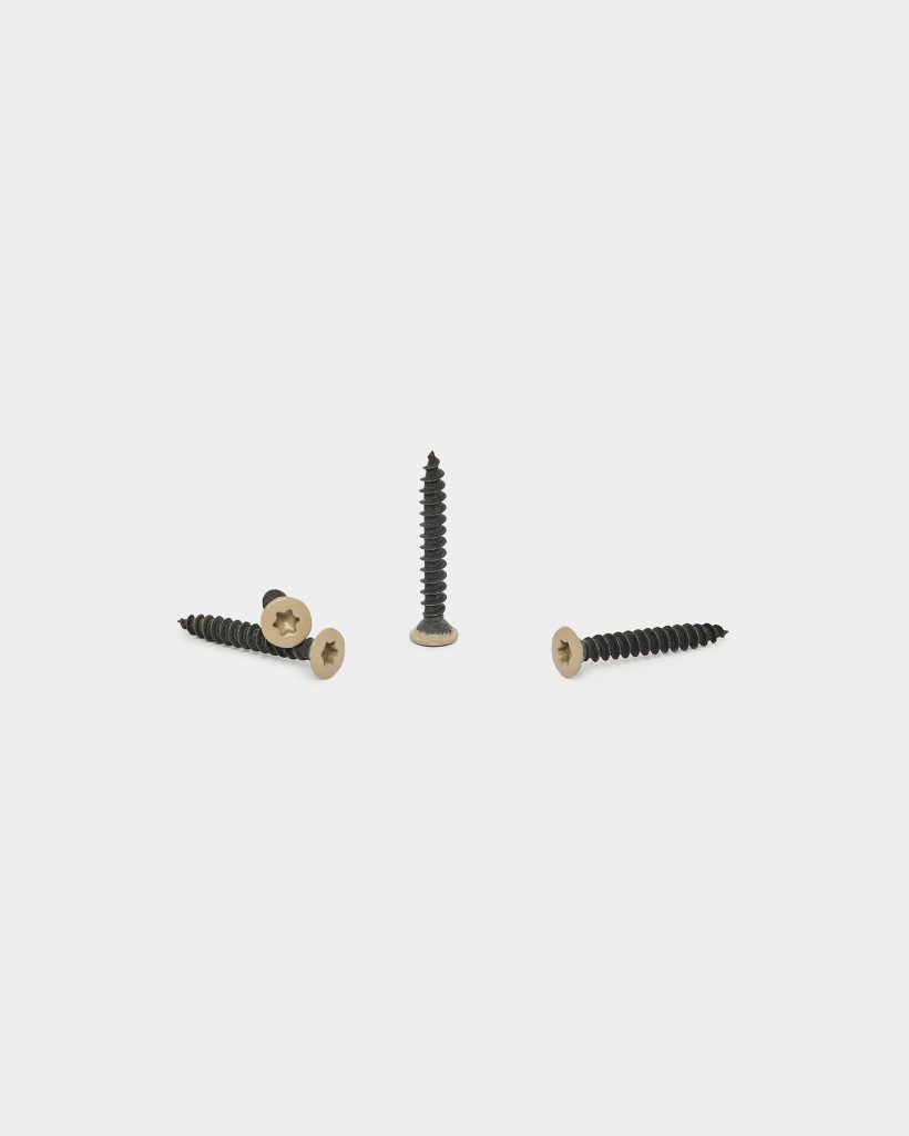 WoodUpp product photograph showing four WoodUpp wood screws arranged on a white background: one screw upright and three laid flat. Each is a black, coarse-threaded screw with a flat, countersunk, tan-coated star-drive head, designed for timber fastening and concealed finish.