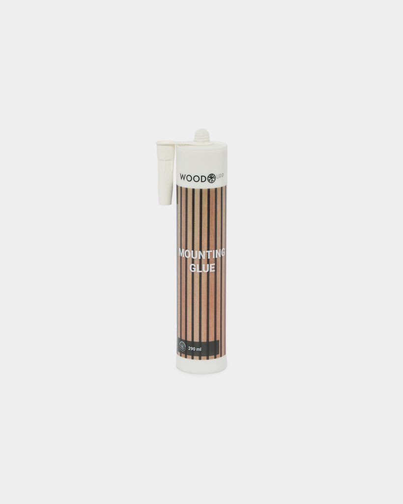 White WoodUpp mounting glue cartridge with detachable pointed applicator nozzle, standing upright against a white background; cylindrical 290 ml tube features a brown vertical wood‑grain striped label reading "Mounting Glue" and a white threaded cap, designed for mounting and woodworking applications.