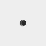 WoodUpp black round cabinet knob centered on a white background. The small metal knob features a knurled cylindrical side and a decorative cracked radial pattern on its top face, showing subtle matte finish and a shadow beneath. Simple product shot highlighting texture and shape.