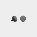 White background with two WoodUpp black knurled metal knobs laid side by side: one shows a short threaded stud and textured grip, the other displays a flat felt-padded base. Both are matte black, compact circular mounting knobs designed for furniture or accessory attachment.