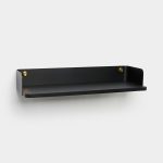 WoodUpp black wall shelf: minimalist wall-mounted shelf featuring a matte black metal backplate and floating black oak shelf, secured by two round brass studs at each end. Clean lines, slightly raised sides, and slim profile suitable for modern entryways or living spaces.